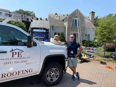 owner of maryland roofing company politz enterprises with company dog on job location