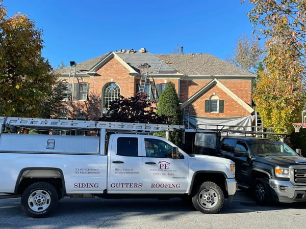 politz enterprises company truck on job site for reroofing project in frederick